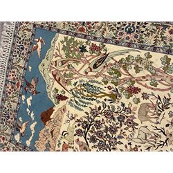 Fine Persian tree of life rug wall hanging, ivory ground field depicting landscape filled with animals, birds and flowers, the guarded border with stylised flower heads and foliage decoration, with brass hanging rail
