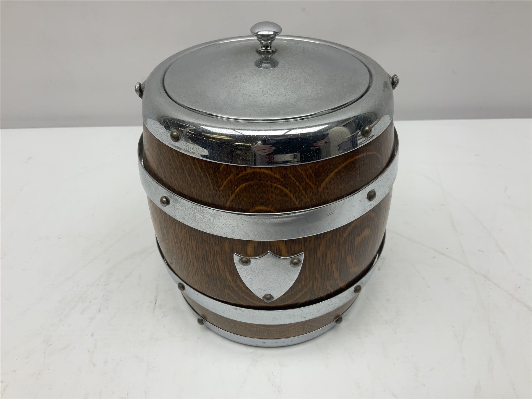 Five early 20th century biscuit barrels with silver-plated mounts