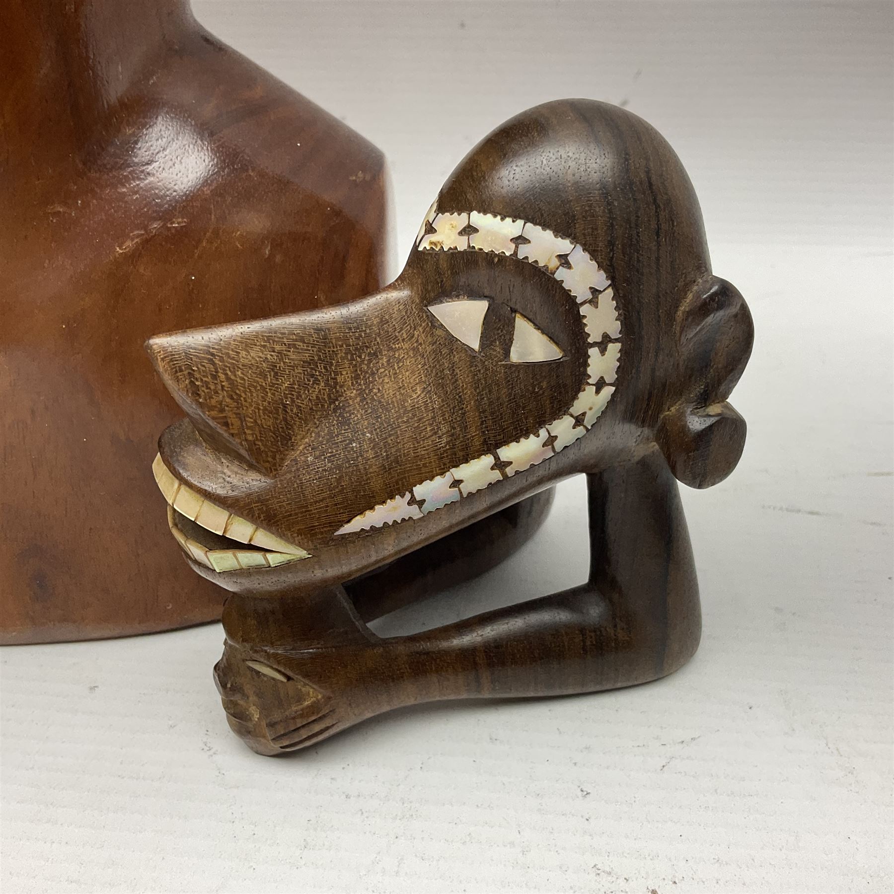 20th century wooden carvings from the Solomon Islands, including female bust in headdress, turtle etc  