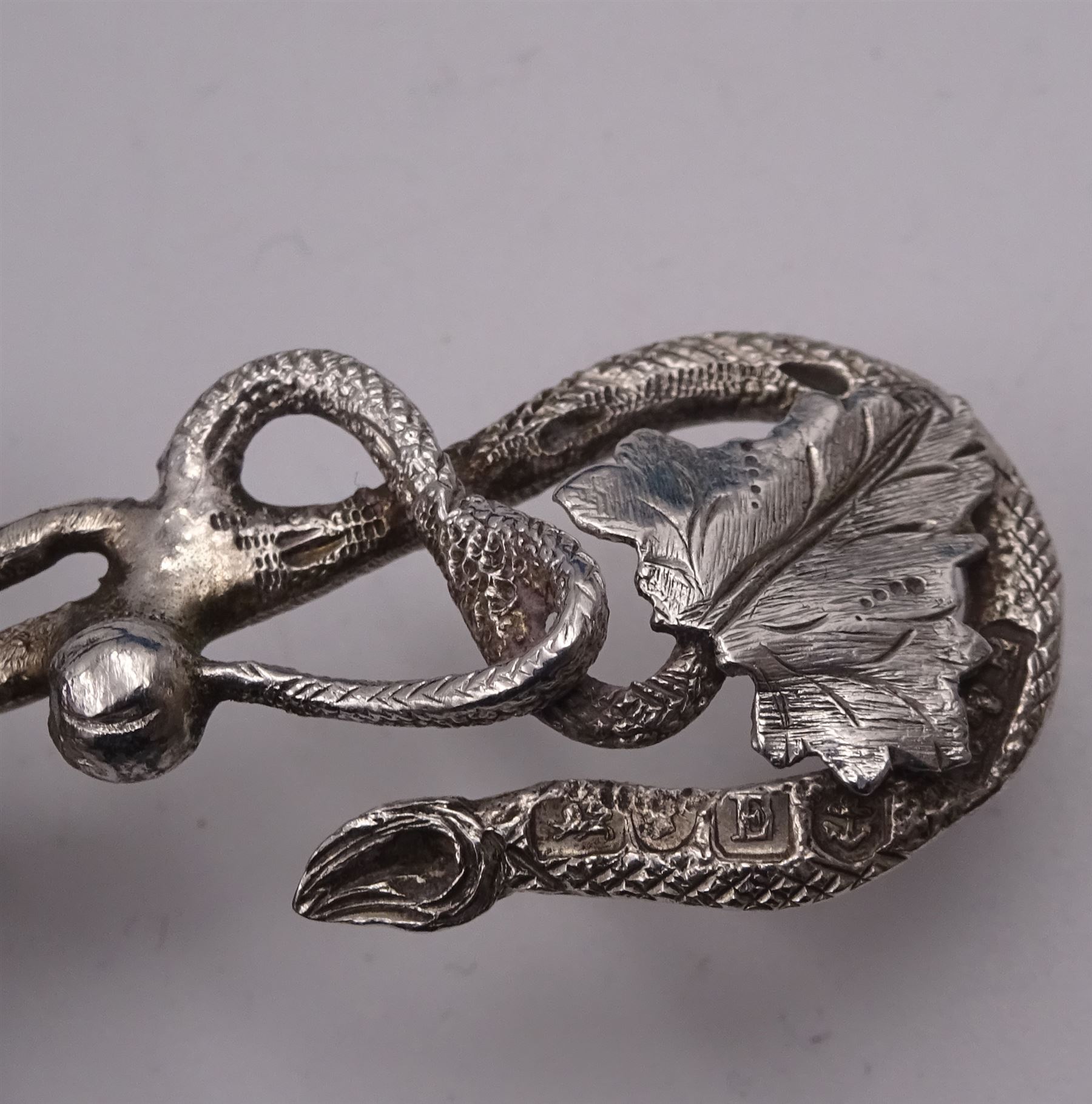 Unusual Victorian silver caddy spoon, the oval parcel gilt bowl embossed with leaf, leading to a flower head mounted tendril handle also detailed with leaf, hallmarked Hilliard & Thomason, Birmingham 1853, L8.5cm, approximate weight 0.49ozt (15.3 grams)