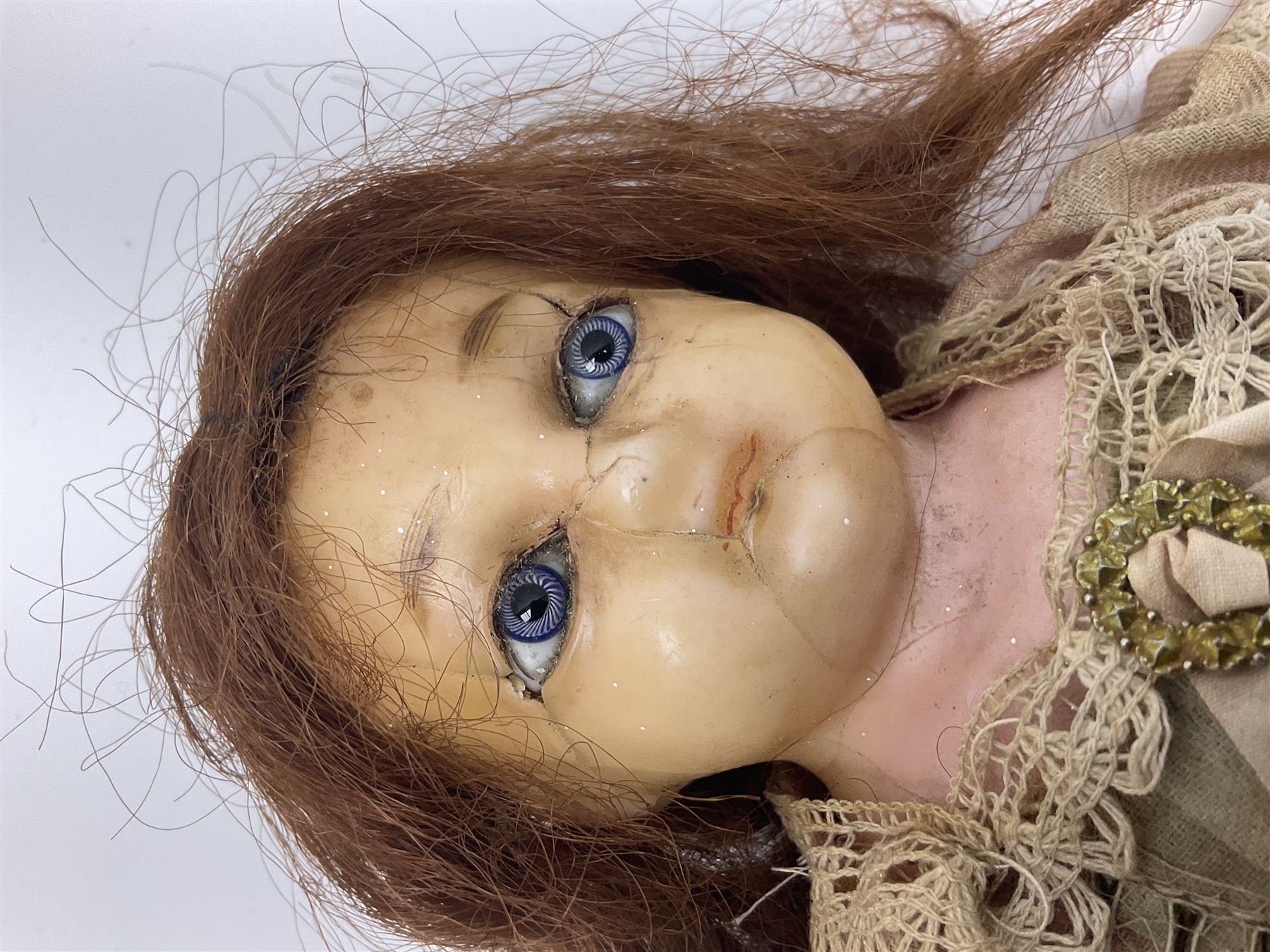 Victorian wax shoulder head doll with applied hair, inset glass eyes and jointed body with composition lower limbs; faded pink dress H35cm