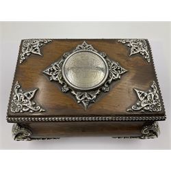 Victorian silver mounted oak casket, of bombe form, with ornate scrolling silver mounts and beaded rim, set with a silver medallion to centre of hinged cover, engraved 