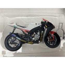 Three Ixo Models 1:12 scale die-cast models of motorcycles - BRB007 Honda NSR500 Michael Doohan 1998; BRB001 Honda RC211V Valentino Rossi 2003; and Yamaha YZR-M1 Colin Edwards MotoGP Phillip Island 2007; all boxed (3)