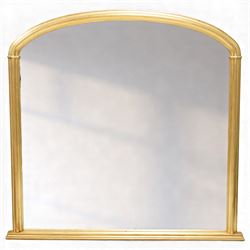 Contemporary large giltwood overmantel mirror, arched rectangular form with reeded moulded...