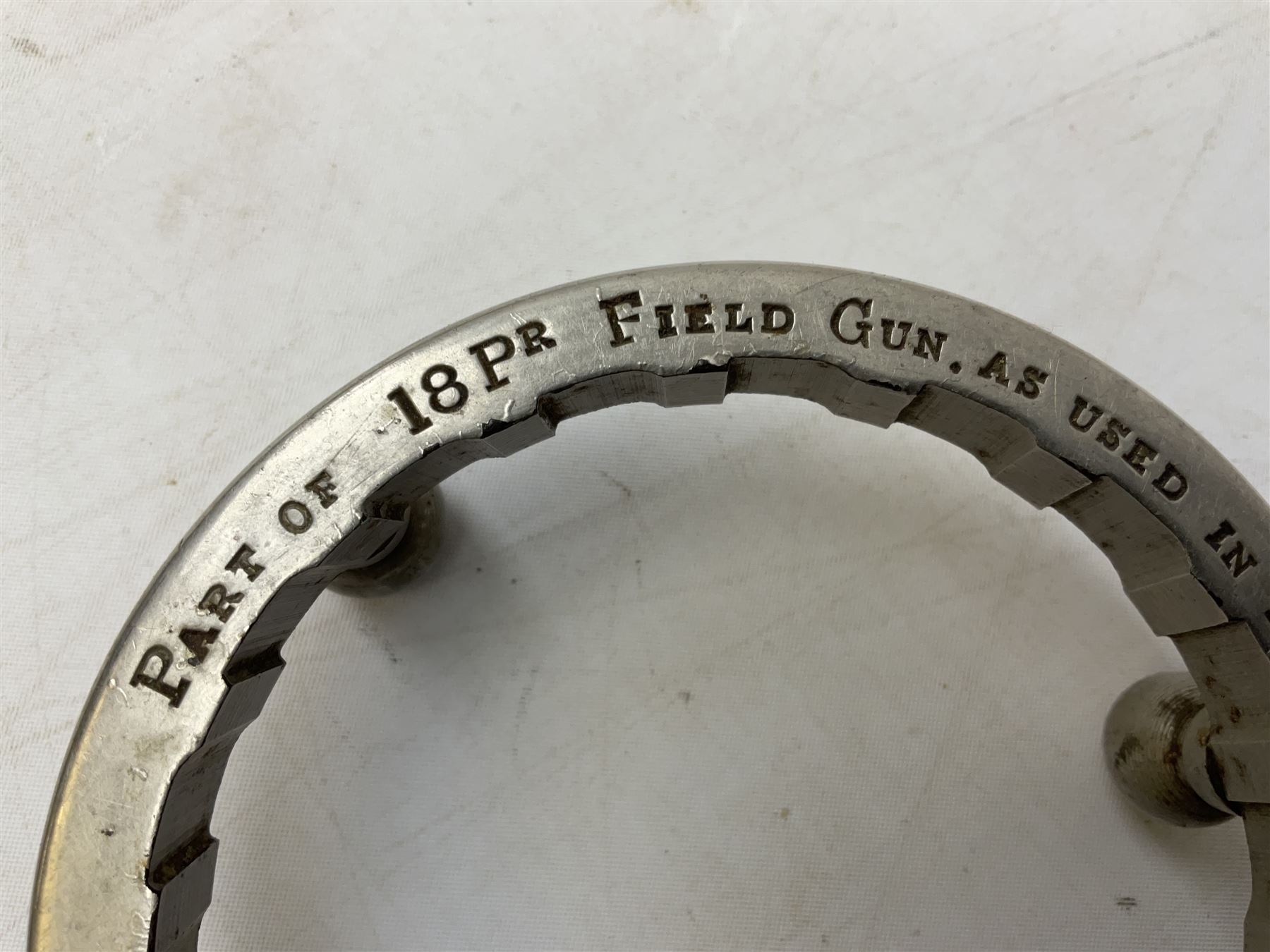 WW1 Trench Art - trivet on three ball feet formed from a section of a gun barrel inscribed 'Part of 18Pr Field Gun, as used in European War 1914.15.16.17.18.' D10cm