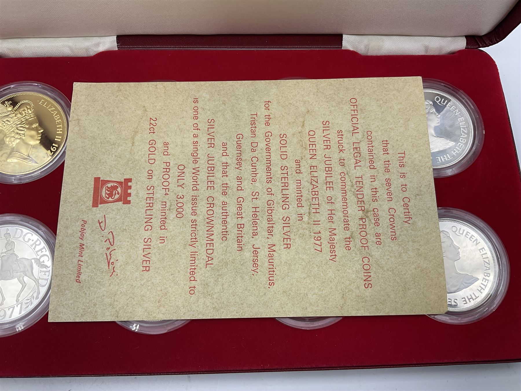 Pobjoy Mint sterling silver proof seven crown coin and gold plated sterling silver proof 'Silver Jubilee Crownmedal' set, commemorating the 'Silver Jubilee of Her Majesty Queen Elizabeth II 1977', cased with certificate