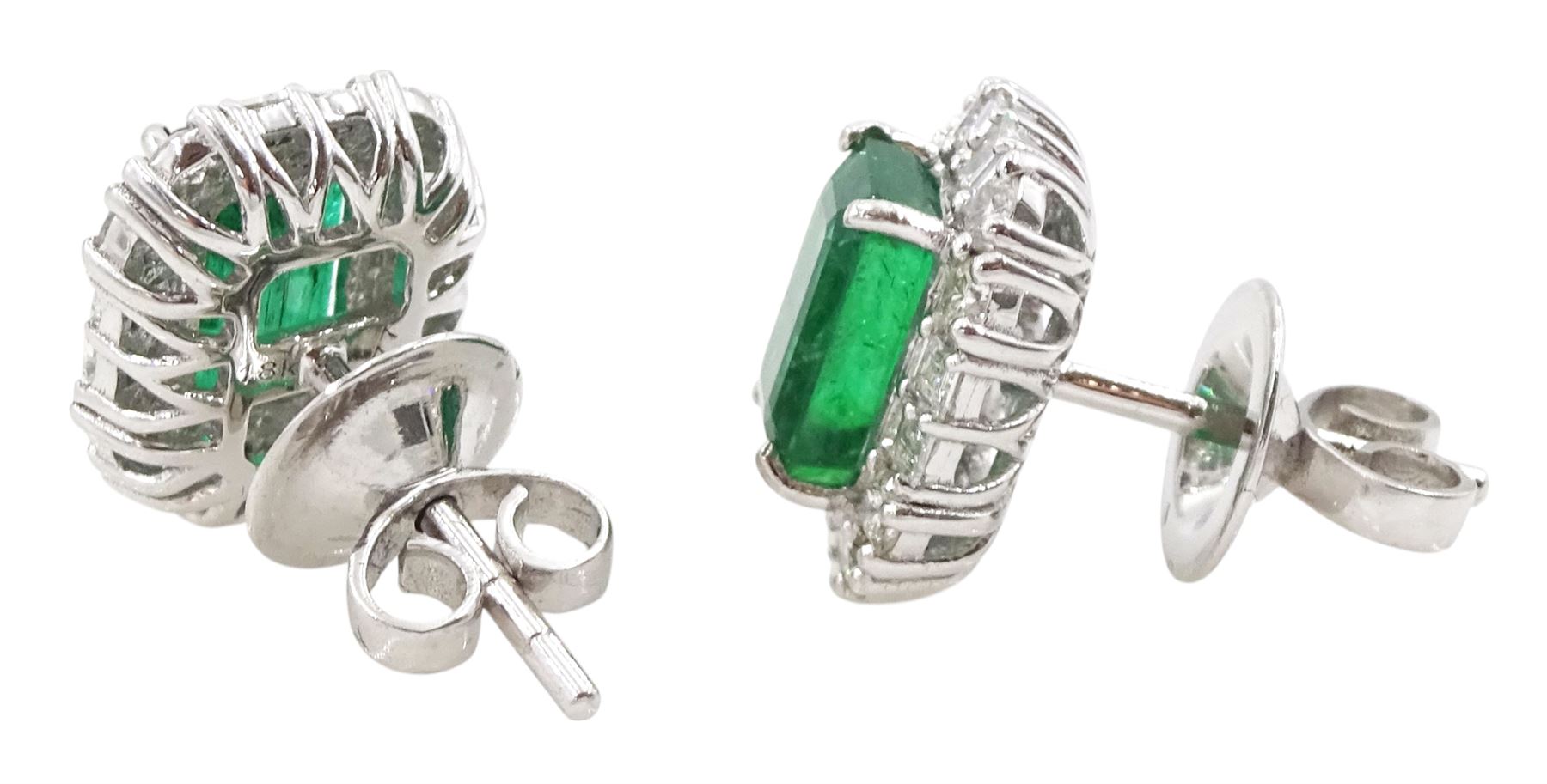 Pair of 18ct white gold emerald and diamond cluster stud earrings, octagonal cut emeralds, with round brilliant cut and baguette cut diamond surround, total emerald weight approx 2.30 carat, total diamond weight approx 0.70 carat