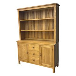 Oak kitchen dresser, raised two-tier back over three drawers and double cupboard