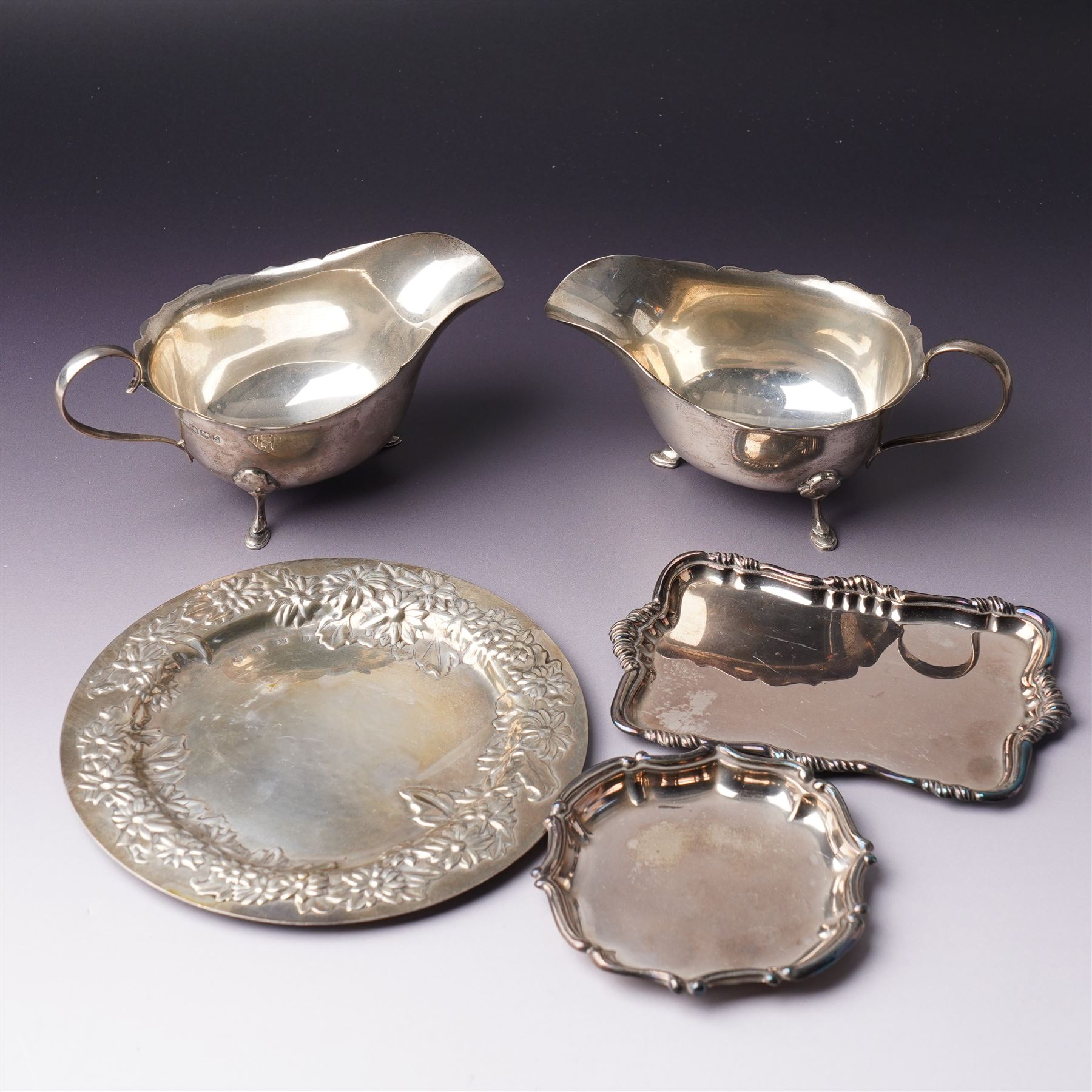 Pair of silver sauce boats with crimped rims Sheffield 1935 Maker Mappin & Webb, small embossed silver tray and two other small trays