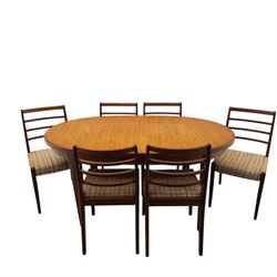 Mid-20th century teak oval extending dining table with set of six teak ladder back chairs ...