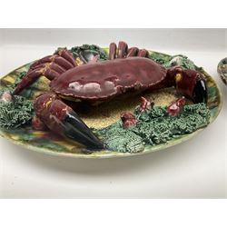 Two 20th Century Portuguese Palissy style Majolica wall plates, one depicting a crab, the other a lobster each to the centre modelled in relief surrounded by encrustations and shells, both with impress marks beneath, D34cm