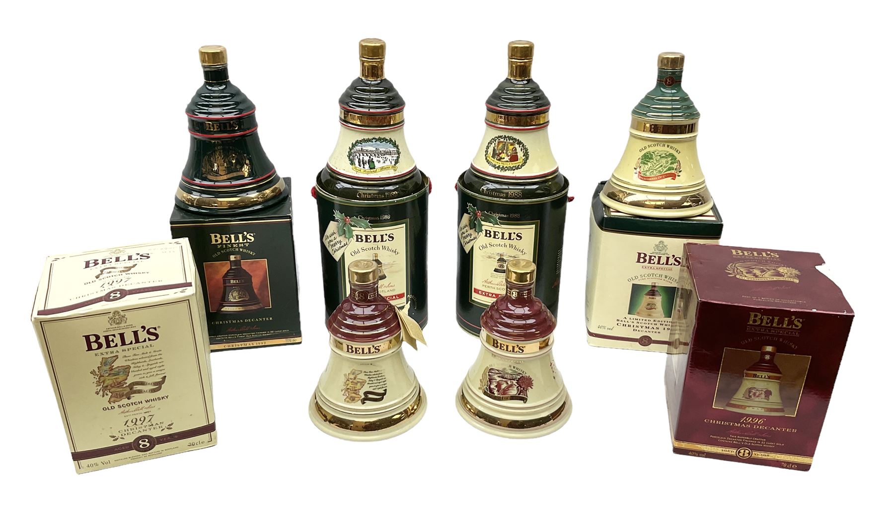 Six Bell's Old Scotch Whisky Christmas ceramic decanters comprising 1988, 1989, 1992, 1996, 1997 and 1998 all in original boxes and decanter seals intact 