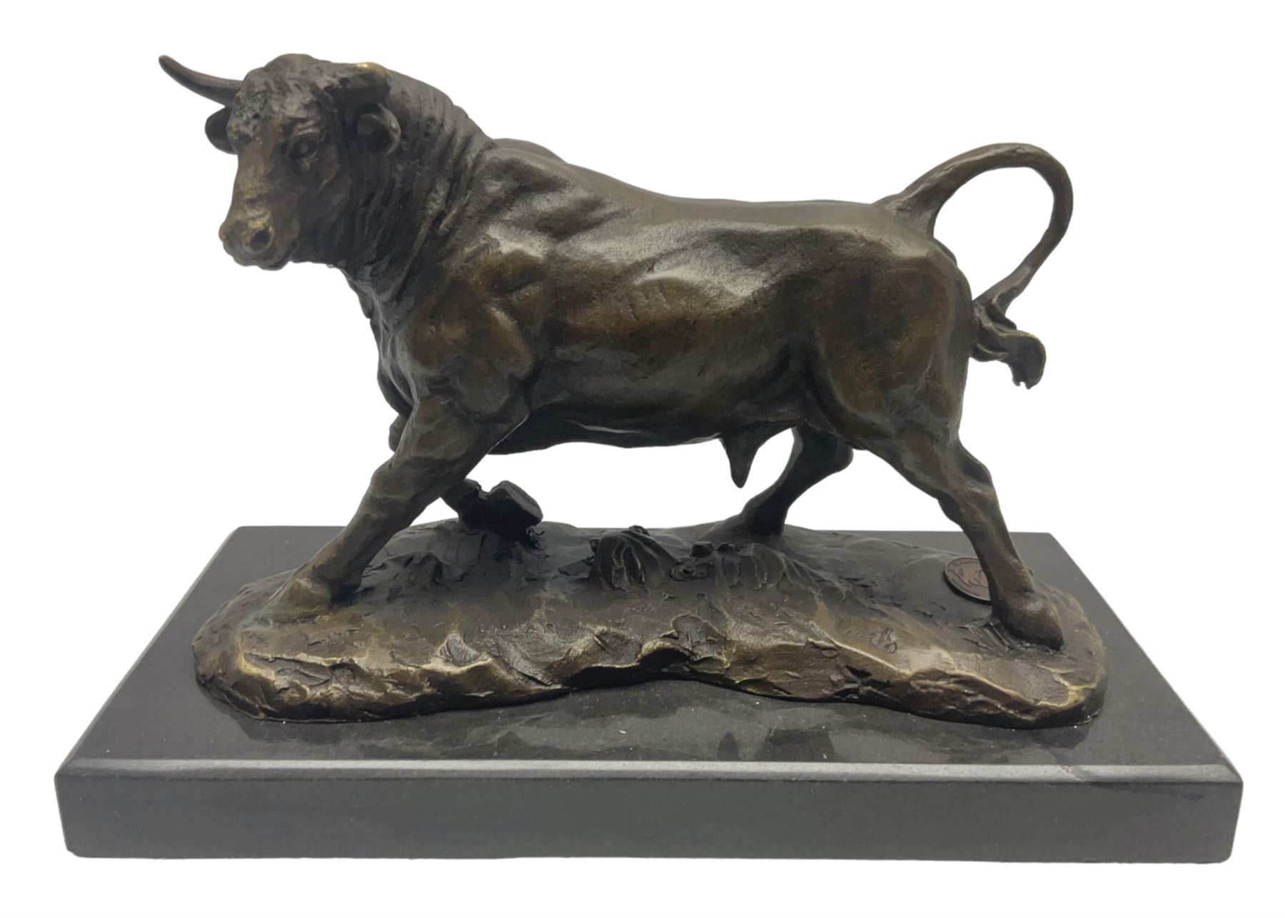Bronze figure, modelled as a prancing bull, upon a naturalistic base signed Mils and with foundry mark, raised upon a rectangular marble base, overall H14cm