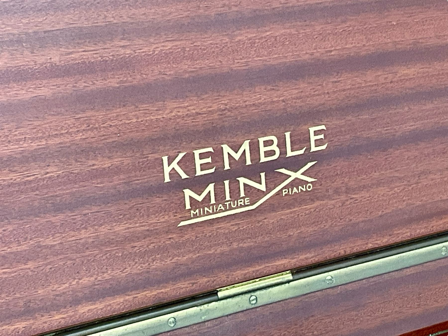 Kemble - Mini X miniature upright piano in sapele mahogany case, with an iron overstrung frame, underdamper action, original hammers, dampers and felts, with sustain and sostenuto pedals, 88 keys (seven octave) keyboard. 
