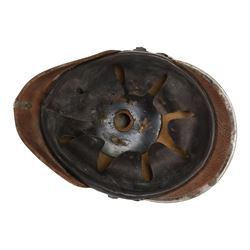 WWI Prussian M1915 Pickelhaube, the black leather skull with removable steel spike finial, steel eagle helmet plate and leather chin strap, one side with a black cockade, the other black and red