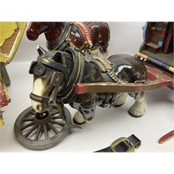 Two ceramic shire horse and gypsy caravans, together with horse brasses 