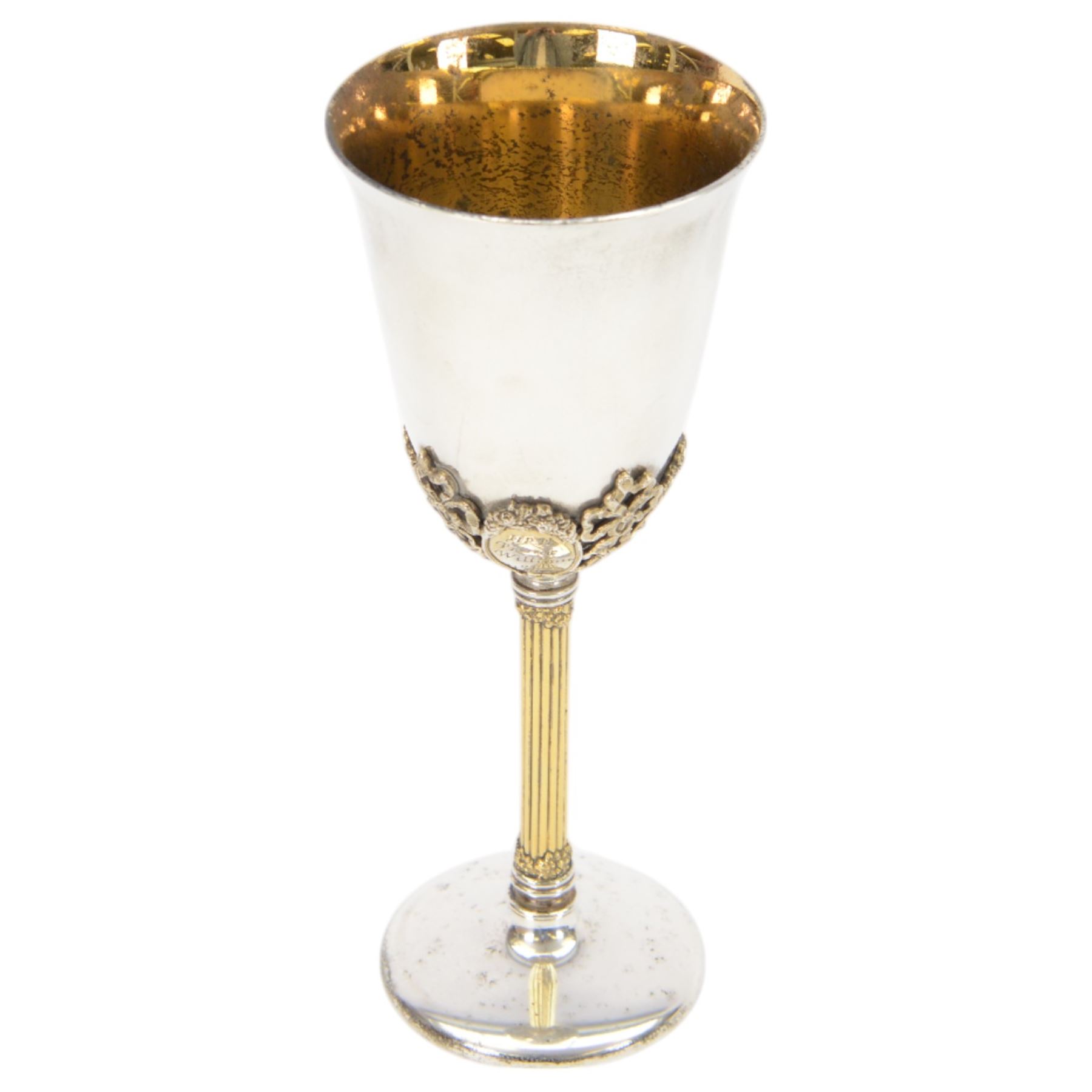 Late 20th century silver goblet, commemorating the birth of HRH Prince William of Wales 21st June 1982, the goblet of plain form, with parcel gilt daffodils and ribbons atop a parcel gilt column stem upon a circular foot, hallmarked St James House Company, London 1982, H19.5cm