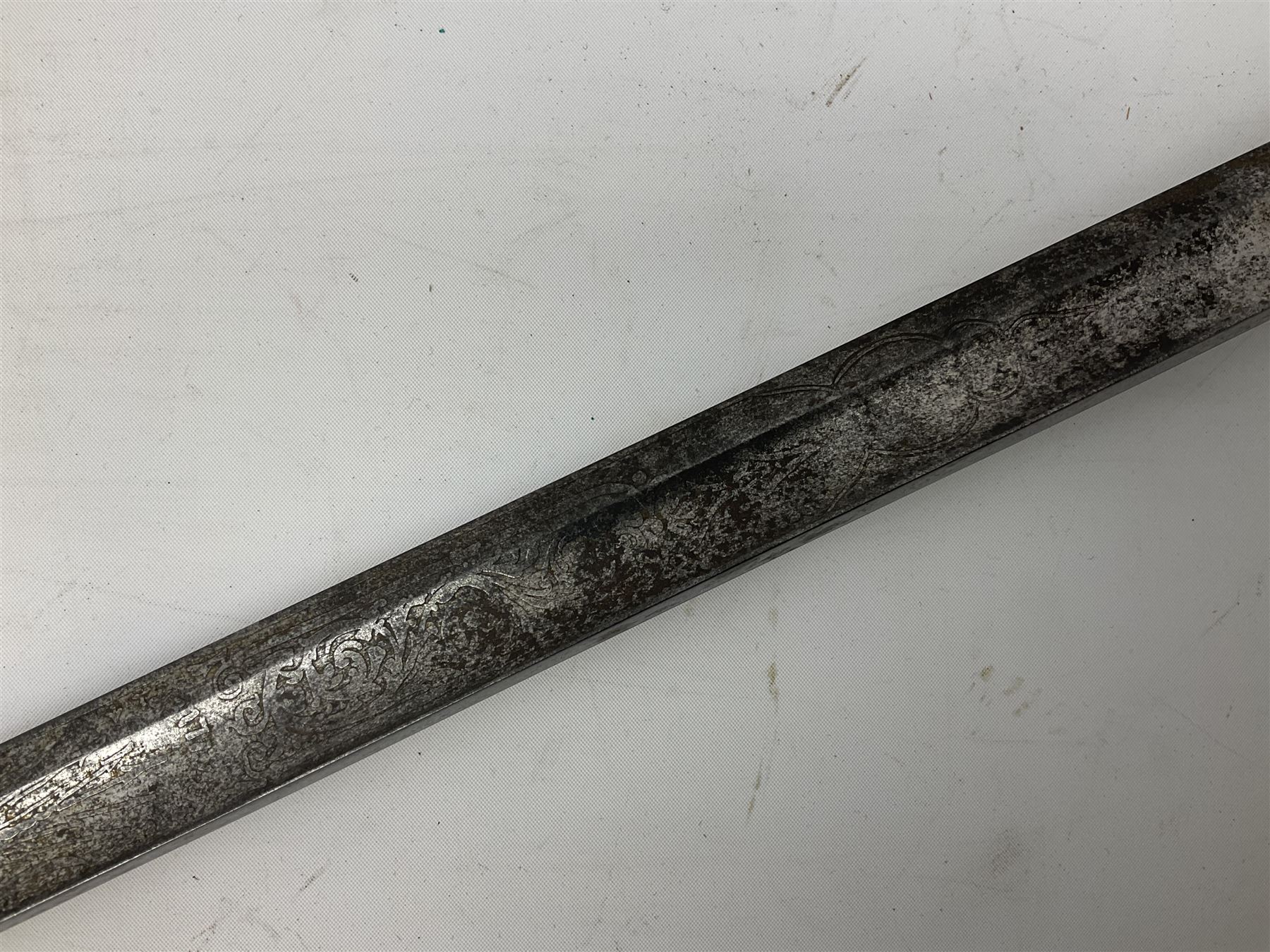 Victorian artillery officer's sword, the 90cm fullered steel blade by E. Thurkle Denmark Street Soho London decorated with Victoria cypher, Regimental crest and 'Royal Artillery', three-bar hilt with stepped pommel and wire-bound fish skin grip; in leather covered scabbard L107cm overall