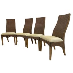Set of six (4+2) wicker dining chairs, upholstered seat cushions, on square tapering elm supports 