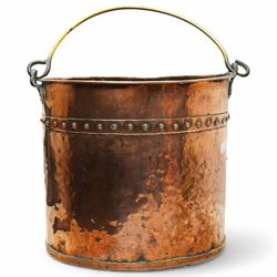 Early 20th century copper bucket, with cylindrical riveted body and brass loop handle, H31cm D34cm  