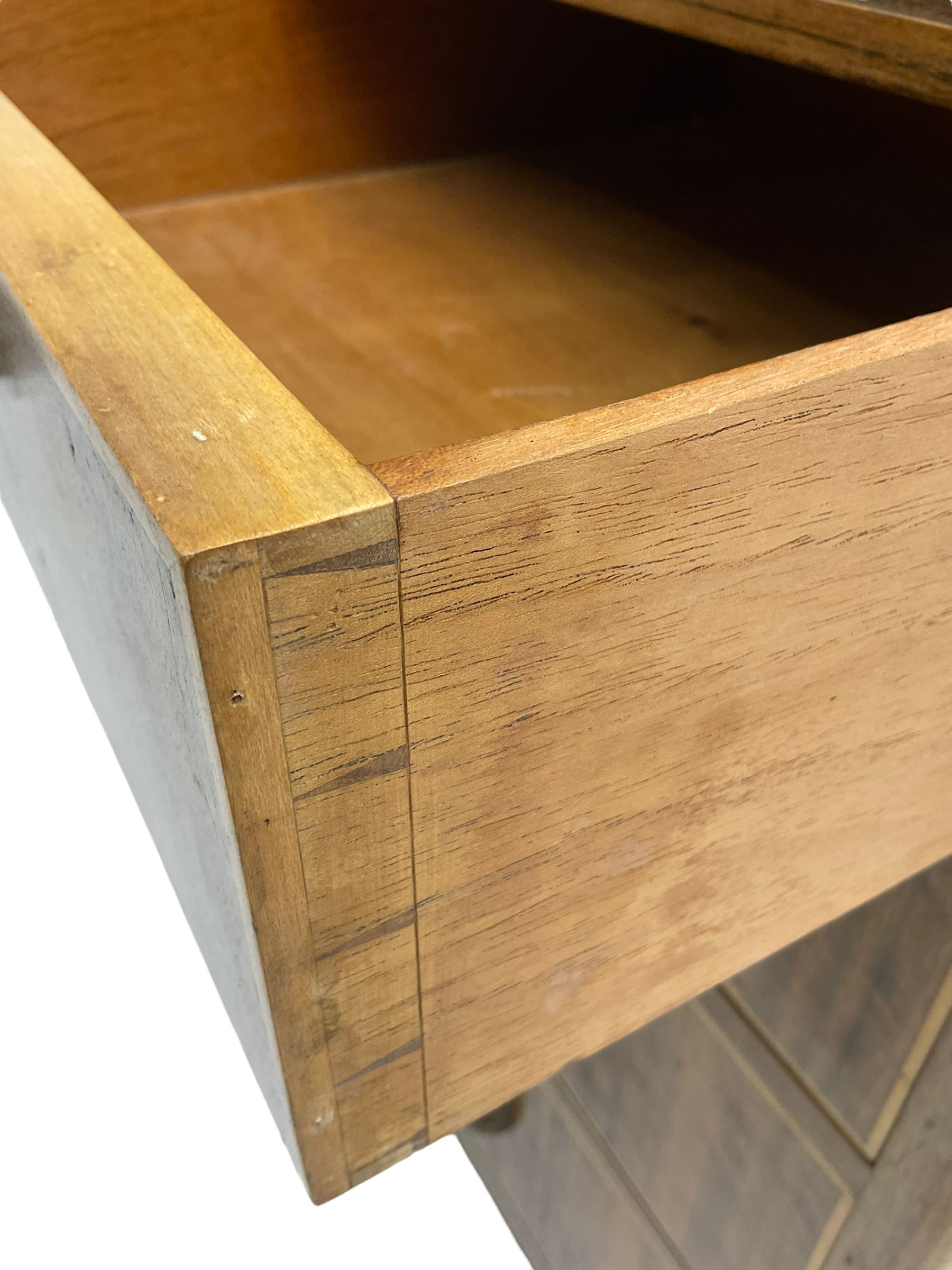 Early 20th century Art Deco walnut cocktail tallboy chest, fitted with double cupboard enclosing two shelves over two short and three long drawers, each with shell shaped handes