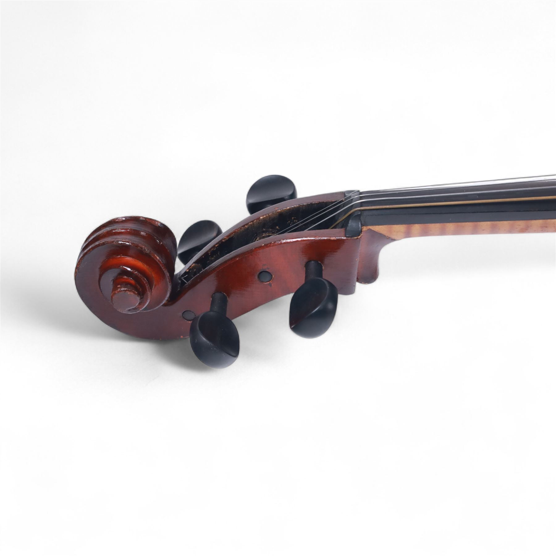 Czechoslovakian 3/4 size cello, with a one piece back, carved scroll neck with ebonised tuning pegs, fingerboard and tail piece, with strings and bridge, no bow. In a soft case.