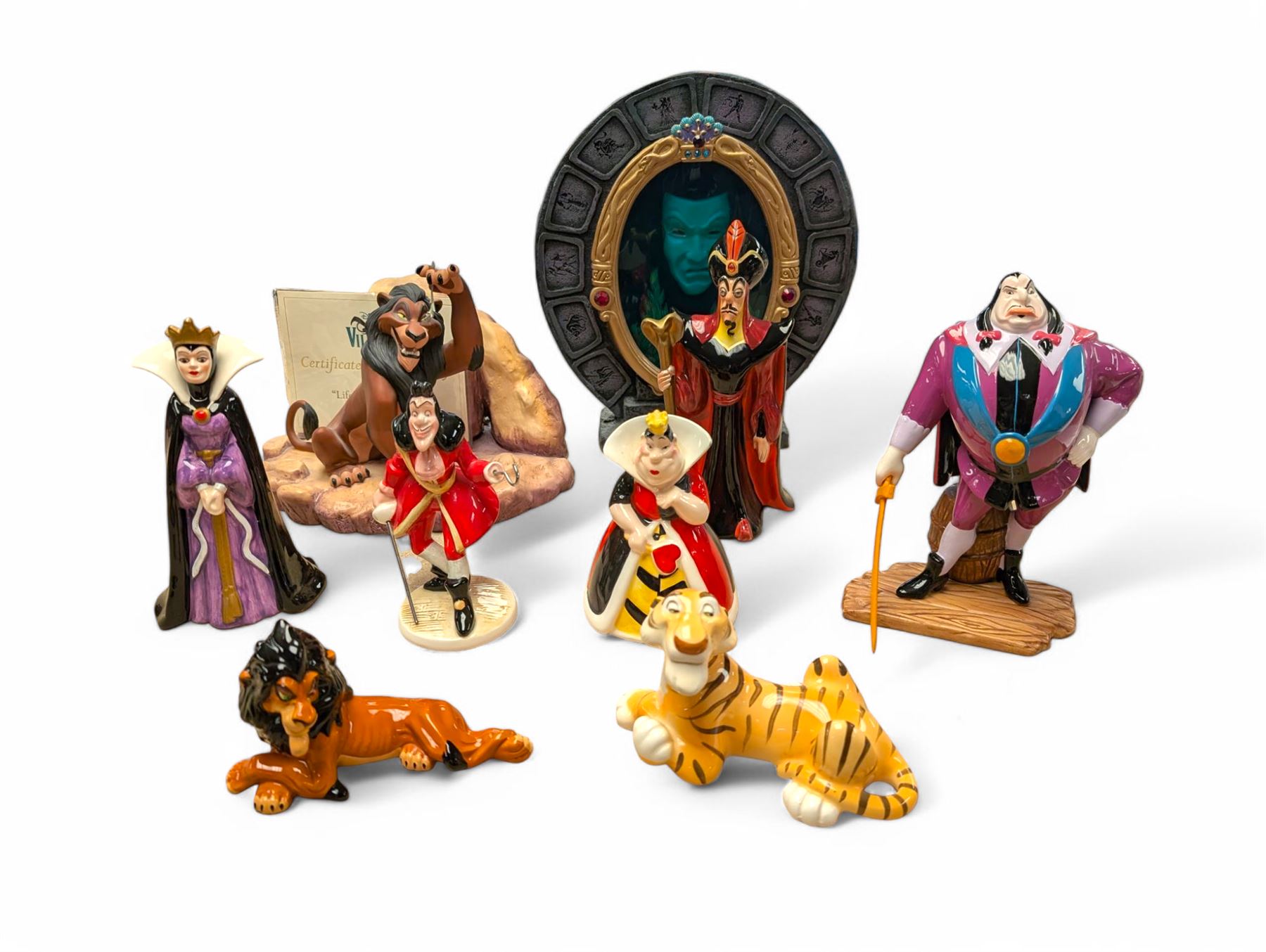 Collection of Disney figurines, comprising Disney Villains 'Life's Not Fair, is it?', with certificate of authenticity, Snow White Magic Mirror and seven ceramic figures including Jafar, Queen of Hearts and Scar