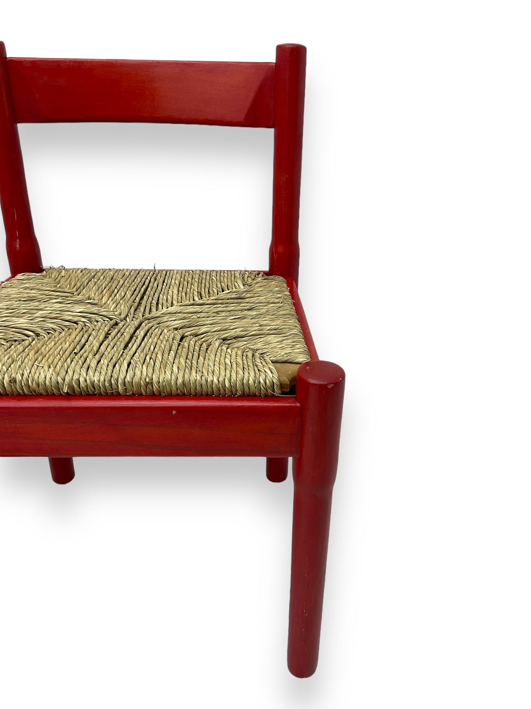 Vico Magistretti - mid-20th century circa. 1970s set of four beech framed dining chairs in red finish, with drop-in rush seats