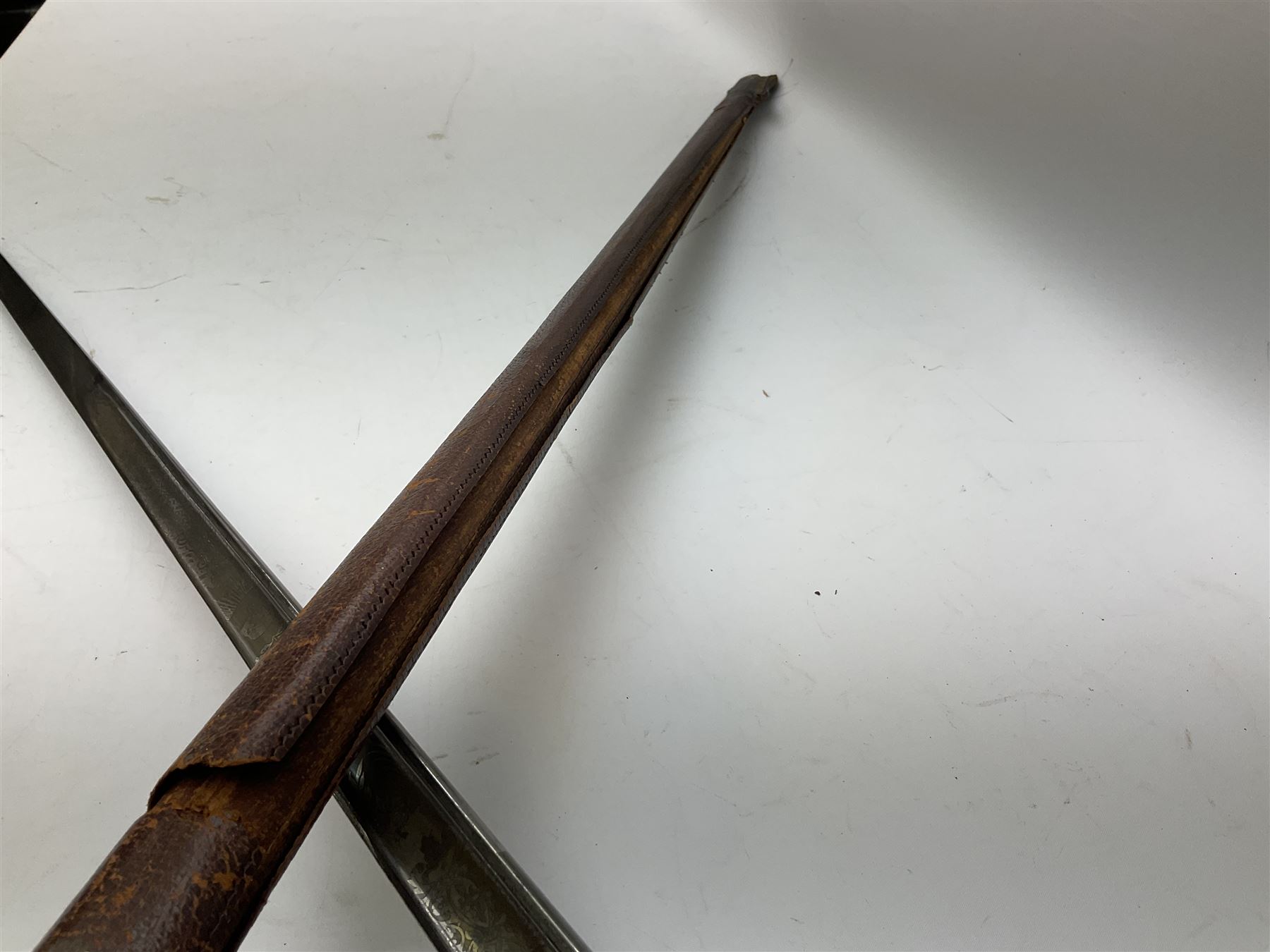 British George V 1897 Pattern Infantry Officers Sword, the 82.5cm fullered steel blade etched and polished with crowned royal arms, GRV cyphers and scrolling foliage, marked Army & Navy Co-operative Society 105 Victoria St London SW to the ricasso,  plated pierced basket hilt with wire bound fish skin grip and leather knot, No.15032; in leather covered scabbard