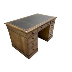 Victorian mahogany twin pedestal desk, rectangular top with moulded edge and inset leather writing surface, fitted with central drawer flanked by four graduating drawers with cock-beaded facias