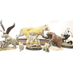 Three Franklin Mint figures, first example On The Prowl, on wooden stand H32cm, L63.5cm, Grizzly, H23cm and American Majesty by Ronald Van Ruyckevelt H37cm, together with a group of five other figures.  