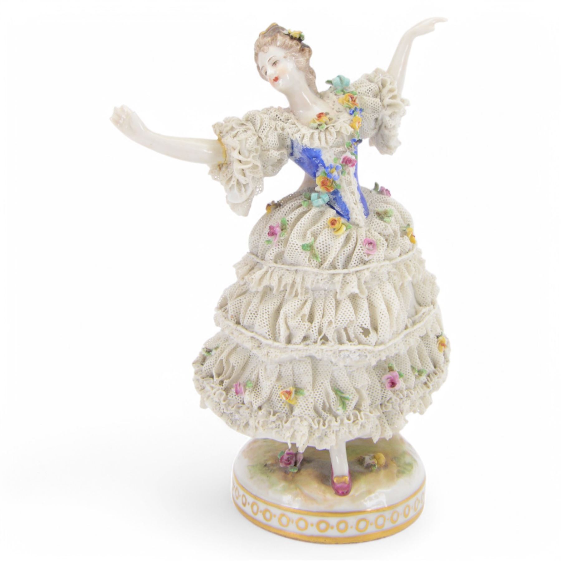 Three Continental lace figures, comprising a figure group modelled as two seated female figures reading, with lace trimmed gowns, H19.5cm, the other two examples modelled female figure with arms outstretched, the lace gowns encrusted with flowers, taller example H21cm