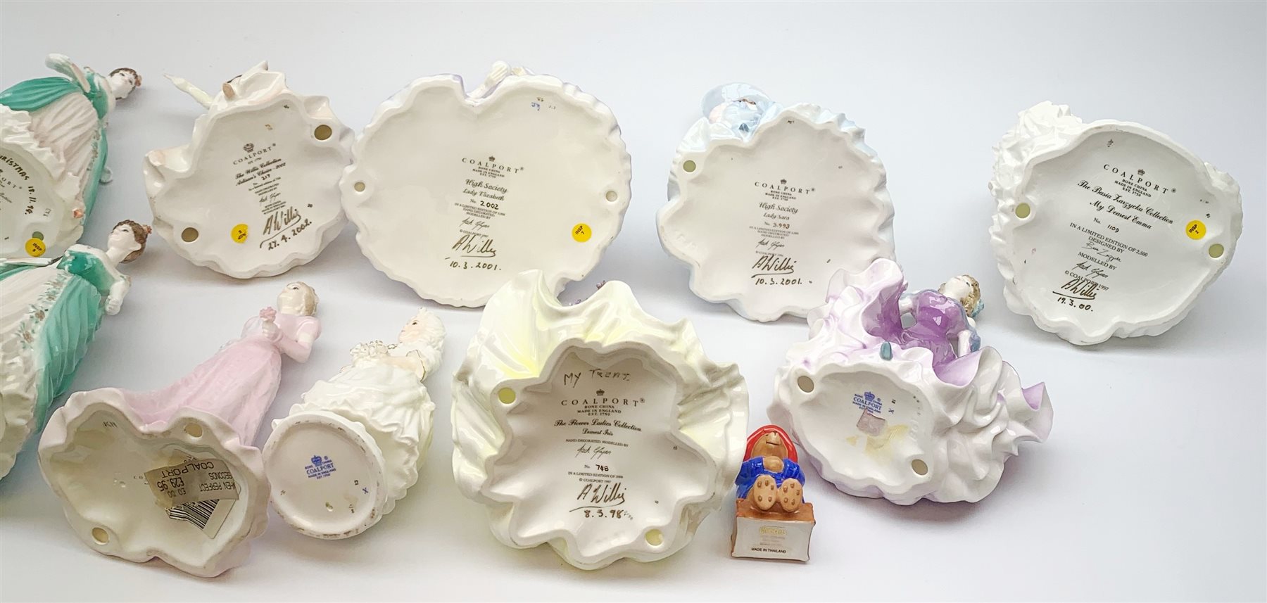 A collection of Coalport figurines, comprising The Flower Ladies Collection Dearest Iris, The Willis Collection Artisan's Choice 2002, two The Park Lane Collection Anniversary Waltz, The Basua Zarzycka Collection My Dearest Emma, High Society Lady Sara, High Society Lady Elizabeth, plus four Second examples, and  Amanda, Page Boy, and Just Arrived. 