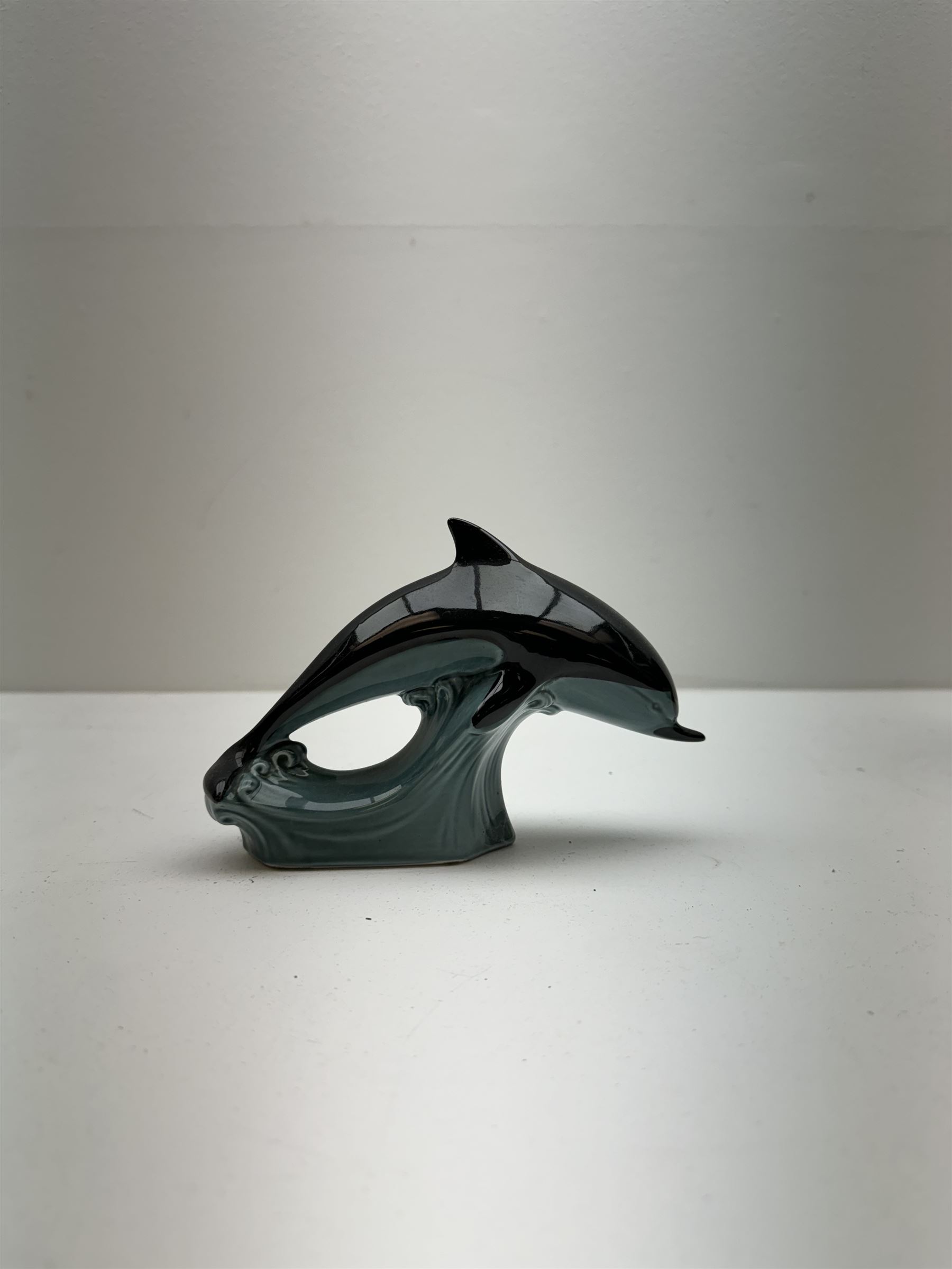 Poole pottery Form vase by Andrew Tanner, decorated with a silhouette of a tree beneath a red sun, together another with Poole pottery vase and dolphin, largest H24cm 