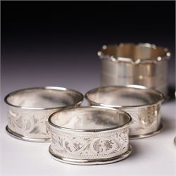 Three engraved silver napkin rings and four others (7)