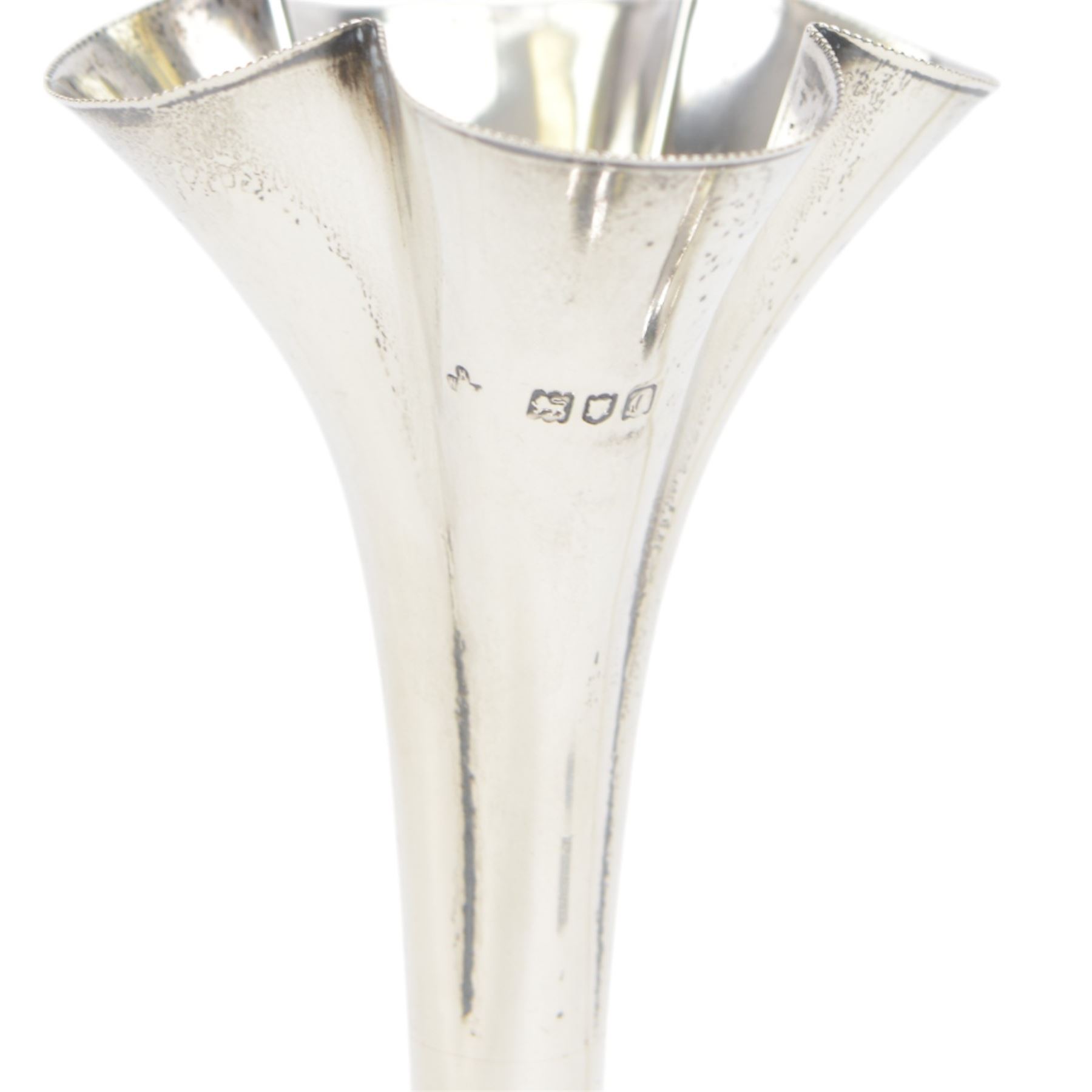 Pair of Victorian silver mounted trumpet vases, with fluted beaded rim, tapering knopped stem and upon circular weighted foot, hallmarked Horace Woodward & Co Ltd, London 1898, H22cm