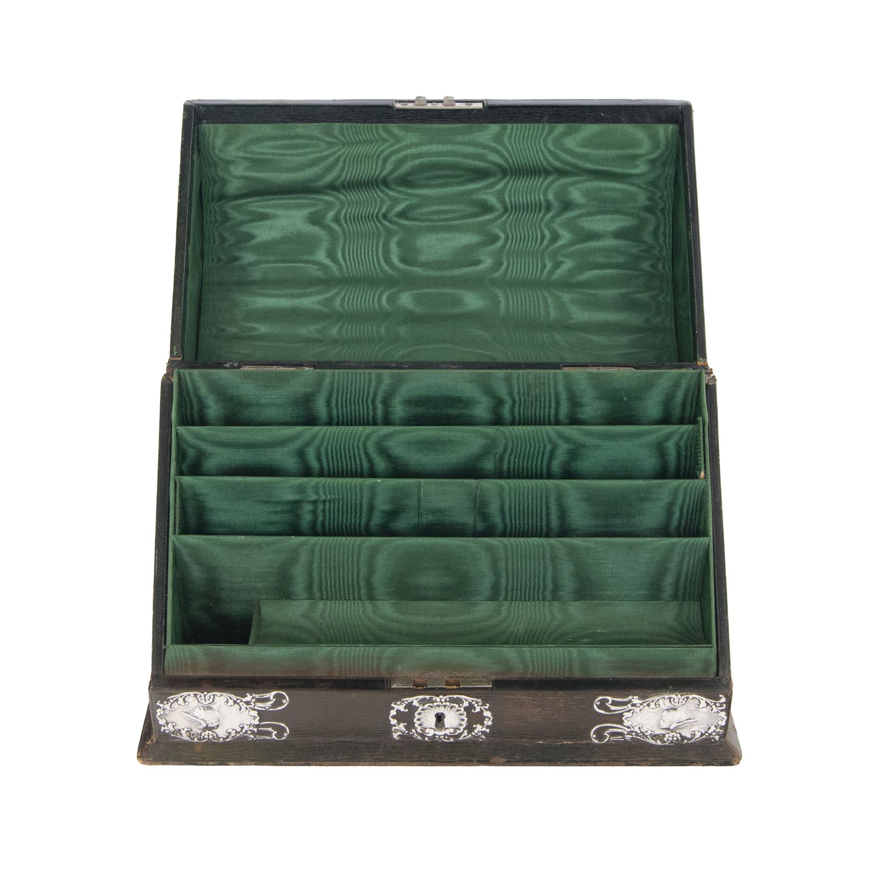 Edwardian silver mounted stationery box and silver mounted blotter, the box of rectangular form with curved front with applied repousse silver panels of putti within a scrolling foliate edge, the hinged cover opening to reveal an emerald green silk lined interior, the blotter with conforming silver mounted panels, each hallmarked William Comyns & Sons, London 1901, box H20cm W31cm D14cm, blotter H32cm W26.5cm