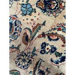 Persian Kashmar camel ground carpet, palmette rosette medallion on a field of curling leafy branches and stylised plant motifs, scrolling border decorated with further palmettes, within floral pattern guard stripes