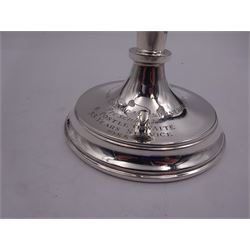 Modern silver twin branch candelabra, the filled circular base with personal engraving leading to a tapering stem supporting a central plain socket with removable nozzle, and two scrolling branches with conforming sockets and nozzles, hallmarked Parkin Silversmiths Ltd, Sheffield 1987, H27cm