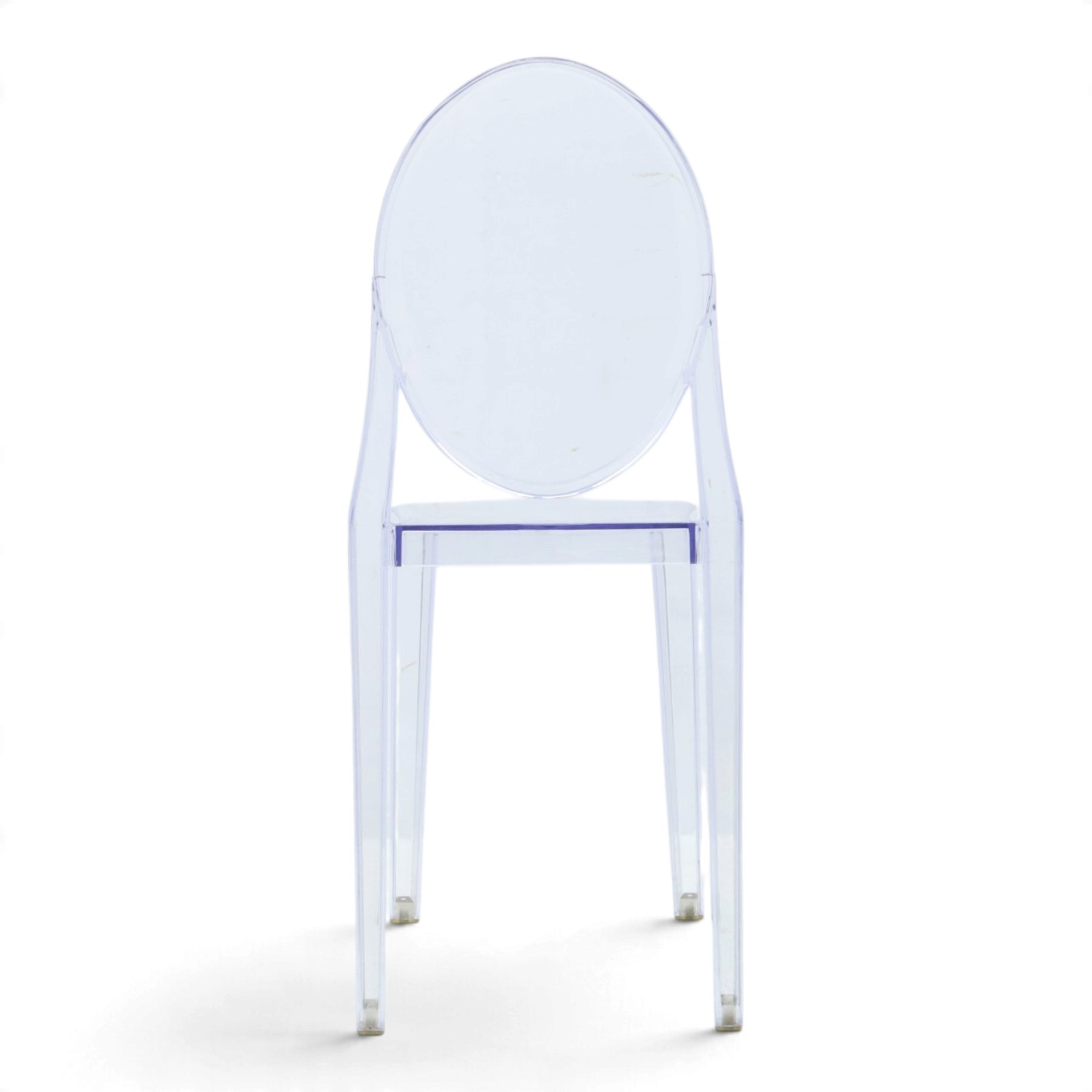 In the manner of Kartell Louis 'Ghost' chairs, transparent moulded plastic, with oval backs and shaped seats, raised on tapering supports
