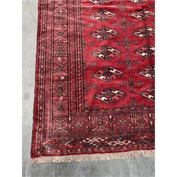 Turkman Bokhara rug, red ground field decorated with repeating Gul motifs