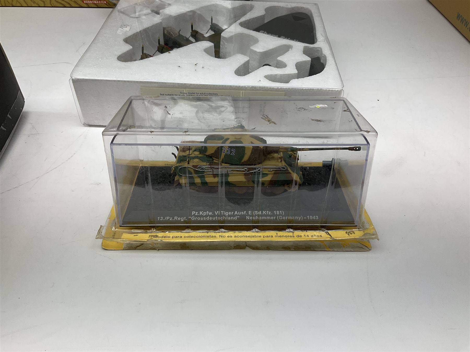 Fourteen die-cast models of aircraft including four Oxford Aviation, two Military Giants of the Sky, two Ixo Models, Corgi Warbirds Messerschmitt, Atlas Editions Spitfire and Messerschmitt, two Hobby Master etc; and two die-cast models of tanks; all boxed (16)
