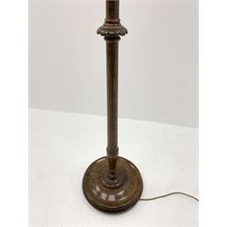 Early 20th century oak standard lamp, tapered column with bead and carved decoration, on a circular moulded platform base, with shade decorated with birds, H153cm (measurement excluding fitting and shade)