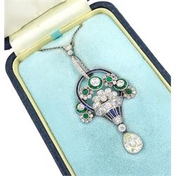Art Deco platinum milgrain set diamond, emerald and sapphire flower basket pendant necklace, the basket set with old cut diamonds, calibre cut sapphires and emeralds, diamonds approx 2.00 carat, suspending a single pear cut diamond of approx 2.05 carat, on a platinum trace link chain necklace, stamped Plat, circa 1915-1920, in fitted box by Licht & Morrison, London