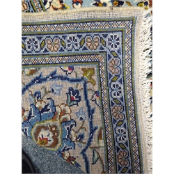  Kashan beige and blue ground rug, central medallion, repeating border, 293cm x 203cm  