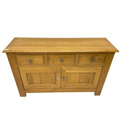 Oak sideboard, fitted with three drawers and two panelled cupboards