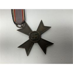 Five WW2 German medals/badges -German Defences West Wall Medal, War merit Cross, Red Cross Decoration, RAD tinnie brooch and Adolf Hitler 1934 medallion (5)