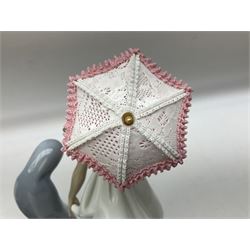 Four Lladro figures, comprising Afternoon Promenade no 7636, Nostalgia no 5071, both with original boxes, Girl with Lilies no 4972 and Madonna no 4534, largest example H27cm