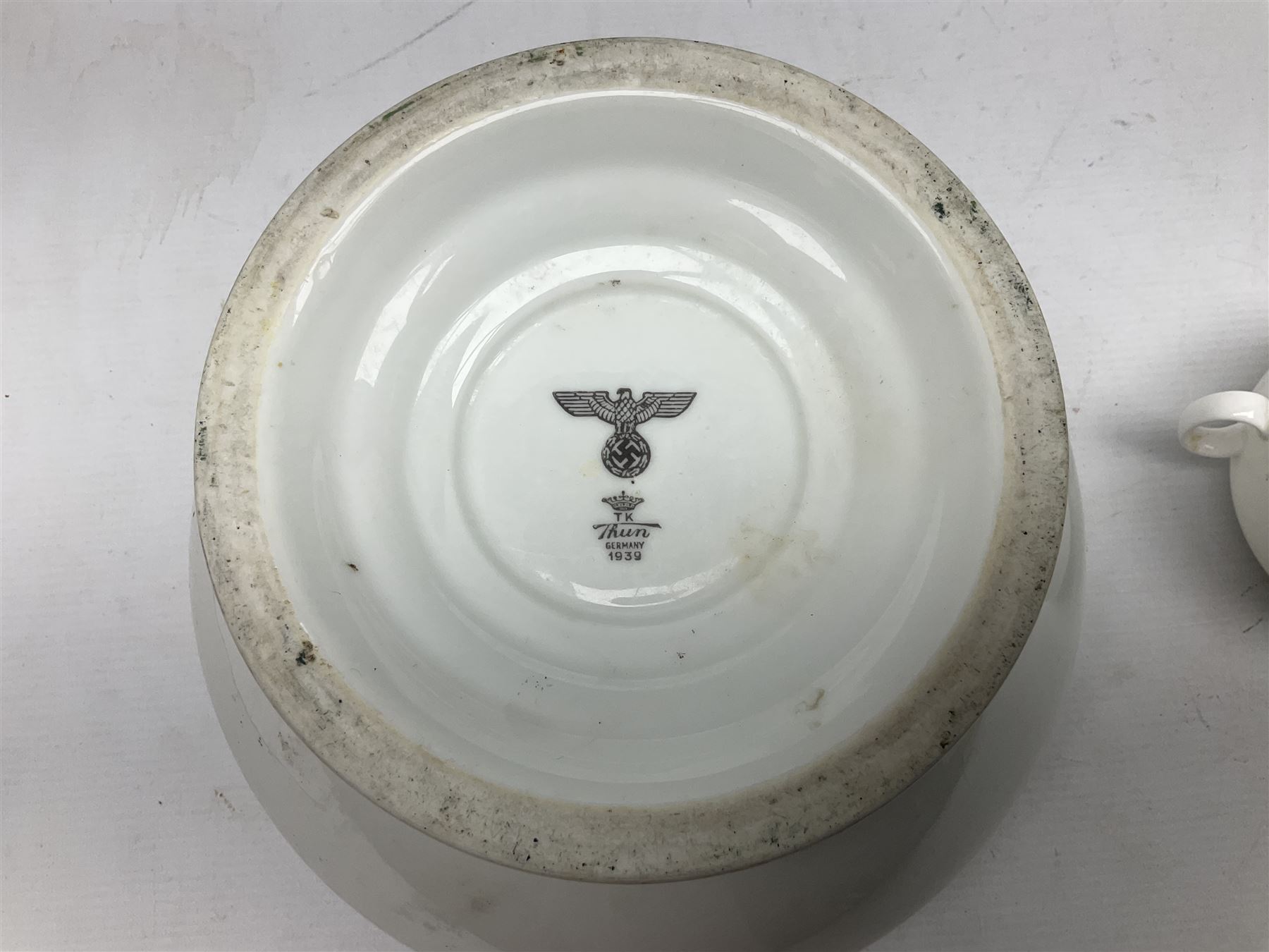 Thun WW2 German Luftwaffe officer's mess plain white glazed soup tureen with lion mask handles, marked with the Luftwaffe eagle beneath and dated 1939 L31cm; together with Waffen 'SS' white glazed twin handled soup bowl, marked beneath Bauscher Weiden 1942 (2)