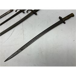 Five 19th century bayonets in relic condition without scabbards comprising British Pattern 1876 socket bayonet with Indian markings; French Model 1874 epee bayonet; and three French Model 1866 sabre bayonets (5)